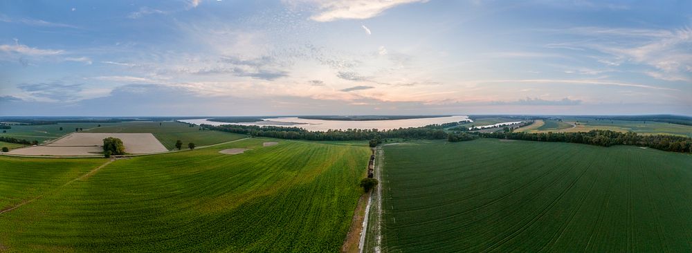 180 degree spherical aerial panorama of the Mississippi River flows in the distance and it is not uncommon to see water…