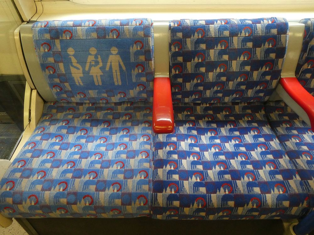 One of several images showing the variations in colour of the 'Barman' design seats inside London Underground Piccadilly…