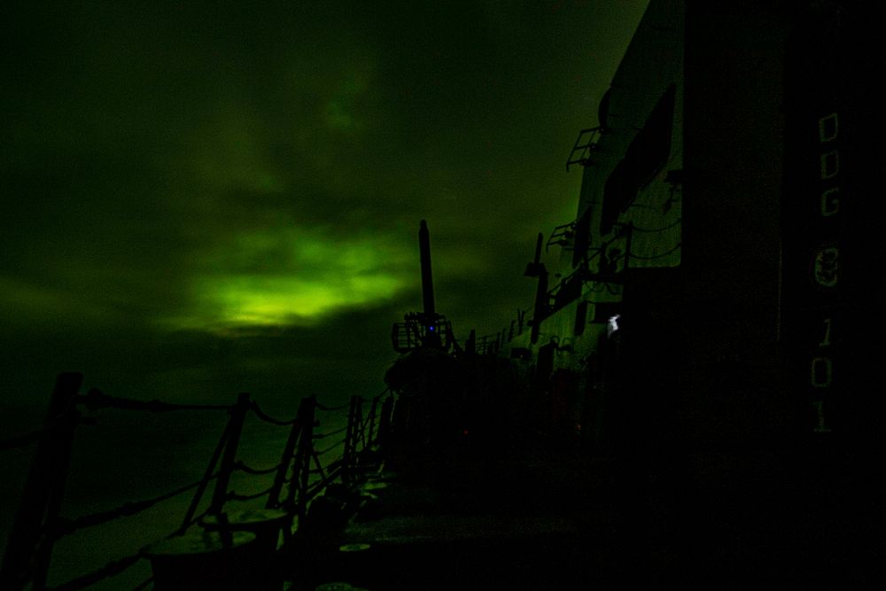NORWEGIAN SEA (Nov. 21, 2019) A long exposure photograph of the aurora borealis is taken aboard the guided-missile destroyer…