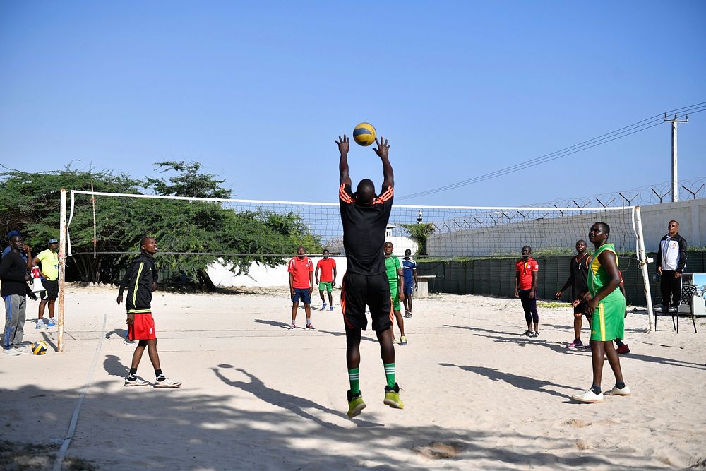 A player goes for the ball in a volleyball match between AMISOM police and military during the AMISOM-UNMAS Sports day, held…