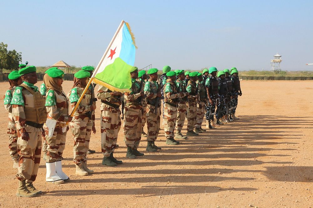 AMISOM soldiers in Beletweyne, Somalia, line up in a guard of honour for outgoing AMISOM Sector Four Commander, Col. Mohamed…