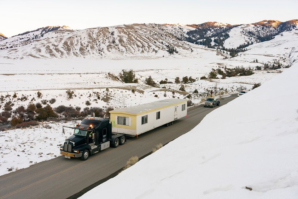 Outdated employee housing trailer being removed from Yellowstone by Jacob W. Frank. Original public domain image from Flickr