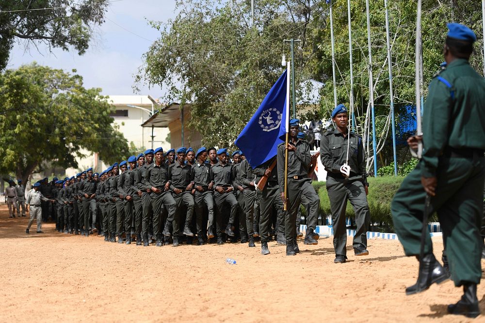 Somali Federal Darwish Police who are part of the Somali Police Force (SPF) march during the pass-out ceremony of a…