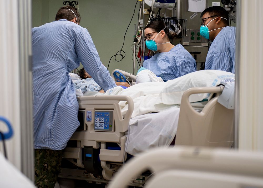 200402-N-PH222-1182 LOS ANGELES (April 2, 2020) Sailors treat a patient aboard the hospital ship USNS Mercy (T-AH 19) April…