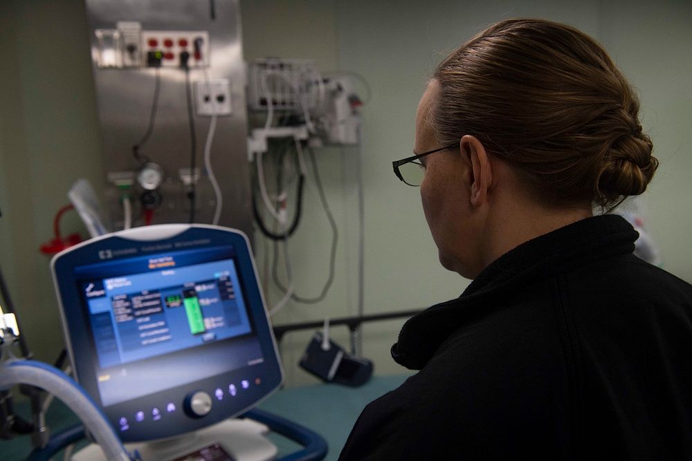 NEW YORK (March 31, 2020) - Hospital Corpsman 1st Class Jennifer Rand calibrates a ventilator aboard hospital ship USNS…