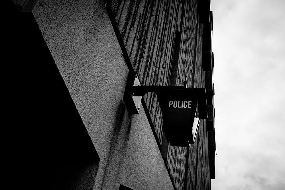 Police station sign in monotone. Original public domain image from Flickr