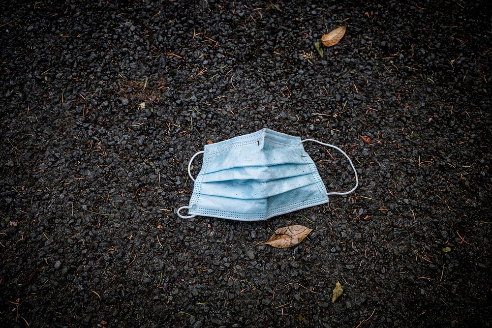 Used facemask left on the street. Original public domain image from Flickr