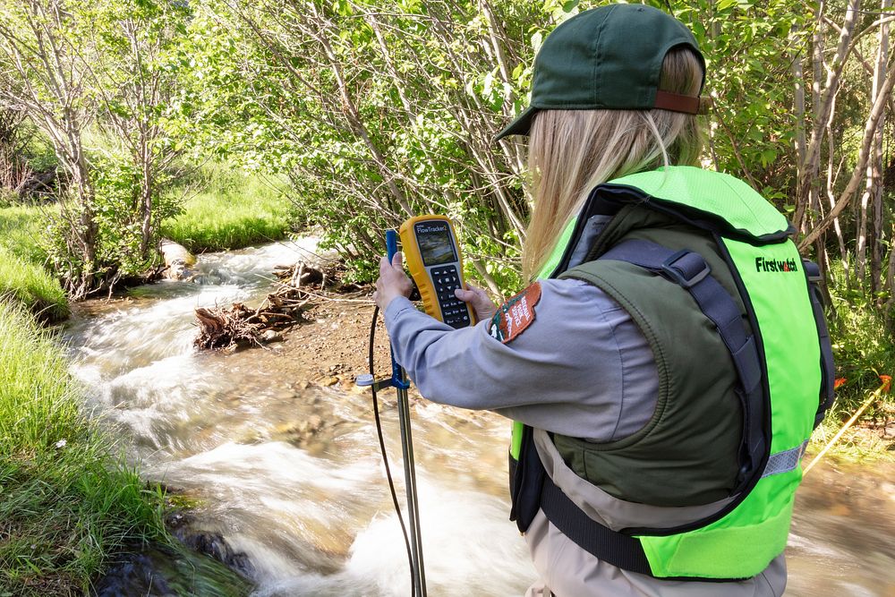 Park hydrologist, Erin White, taking high-precision water velocity measurements in Reese Creek by Jacob W. Frank. Original…