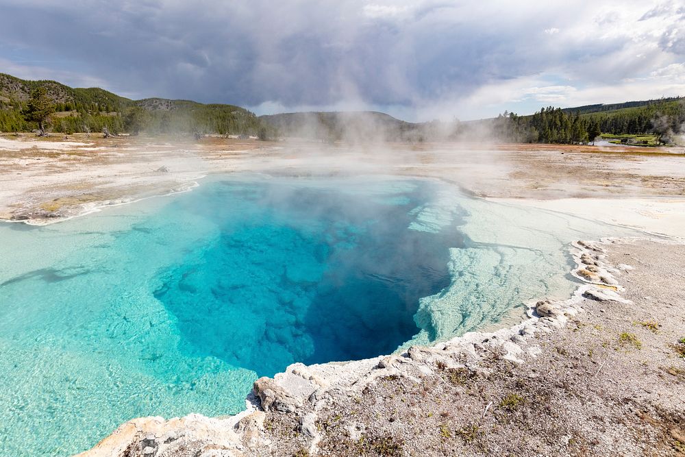 Sapphire Pool steams on a stormy morning. Original public domain image from Flickr