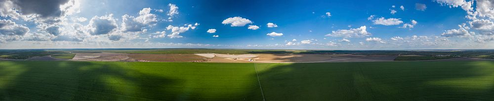 Aerial panorama view from above a sesame field of the Ernie Schirmer Farms cotton harvest that has family, fellow farmers…