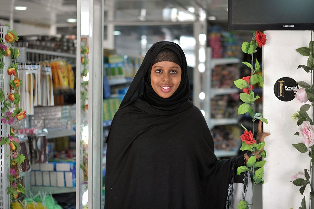 Nasra Agil, the owner of Mogadishu's first dollar store, stands among her products in the Somali capital on 20 January 2014.…