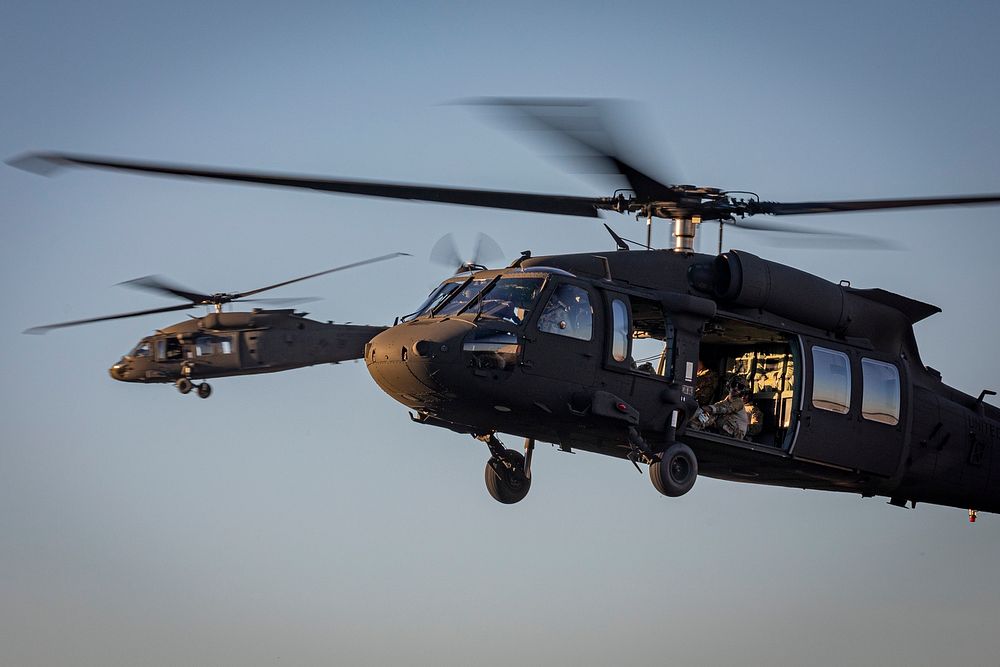 U.S. Army UH-60M Black Hawk helicopters from the New Jersey National Guard’s 1-150th Assault Helicopter Battalion fly during…