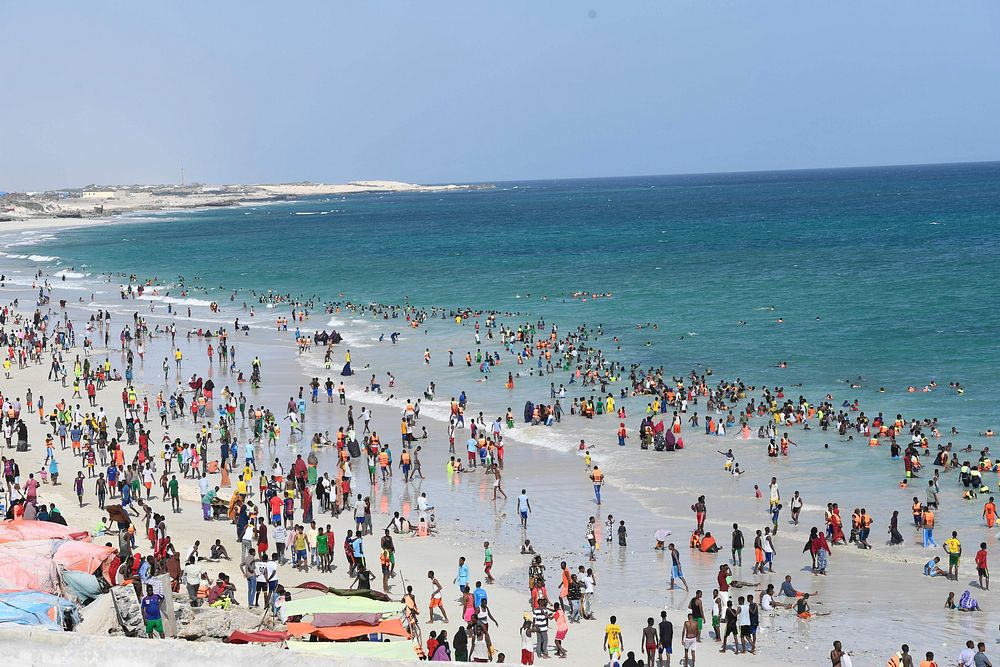 Residents of Mogadishu, Somalia spend their weekends at the Lido beach. Original public domain image from Flickr