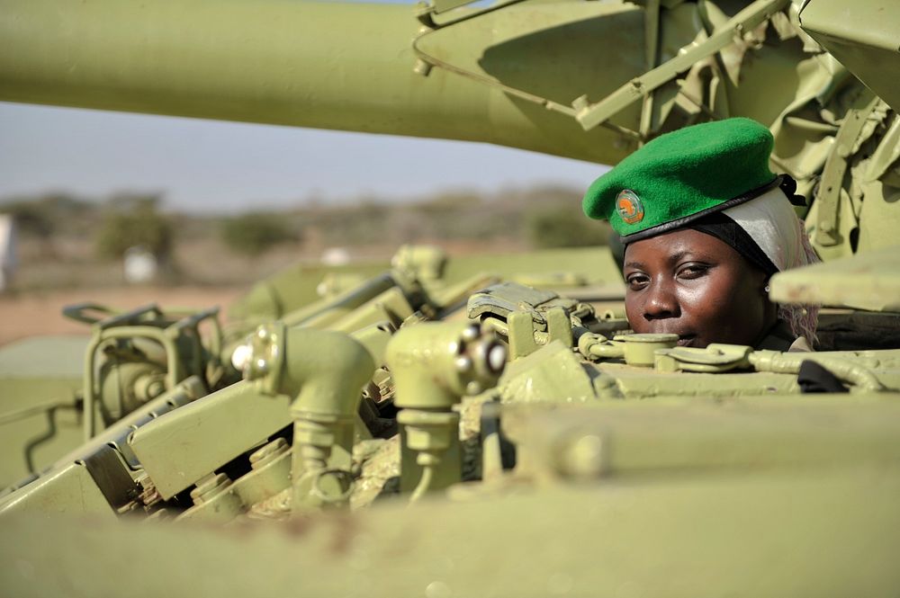 Tank driver, Lance Corporal Mudondo Zabina of the Uganda Peoples Defence Forces, in the drivers section of her tank.