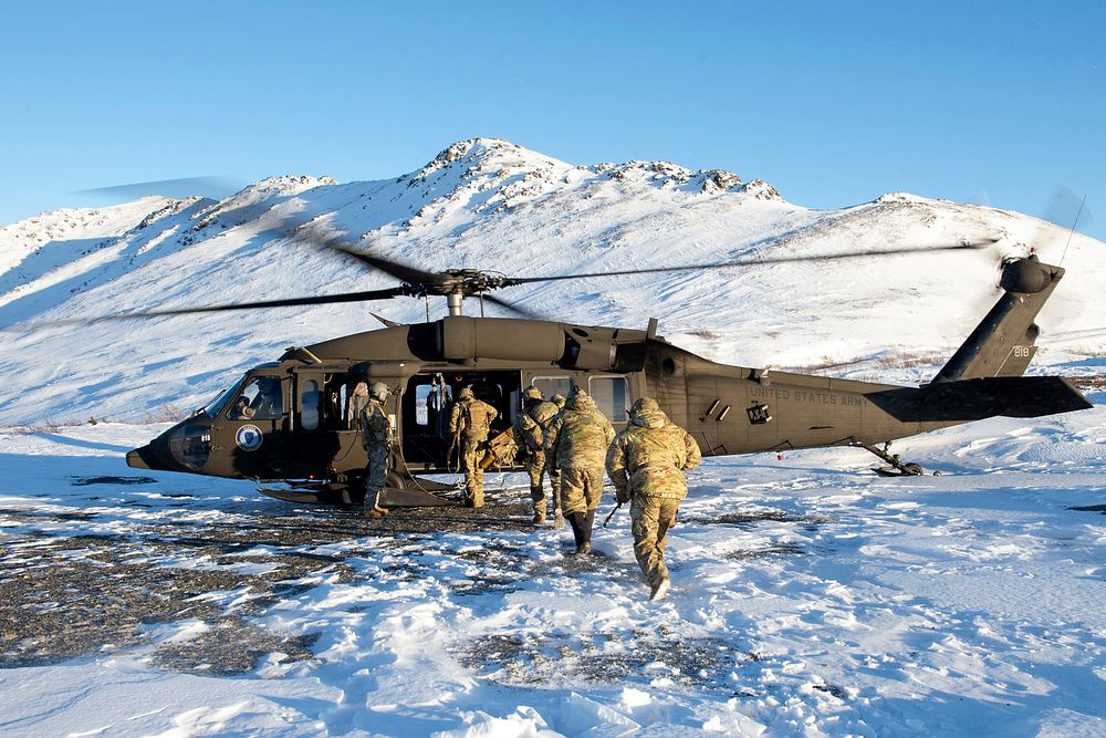 U.S. Air Force tactical air control party specialists assigned to the 3rd Air Support Operations Squadron, board an Alaska…