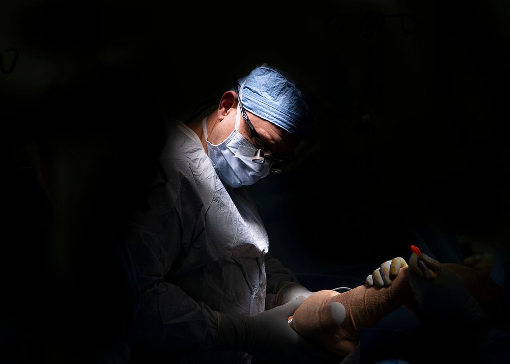 Plastic surgeon prepares a patient for a skin graft procedure in one of the hospital's operating rooms. (U.S. Navy photo by…