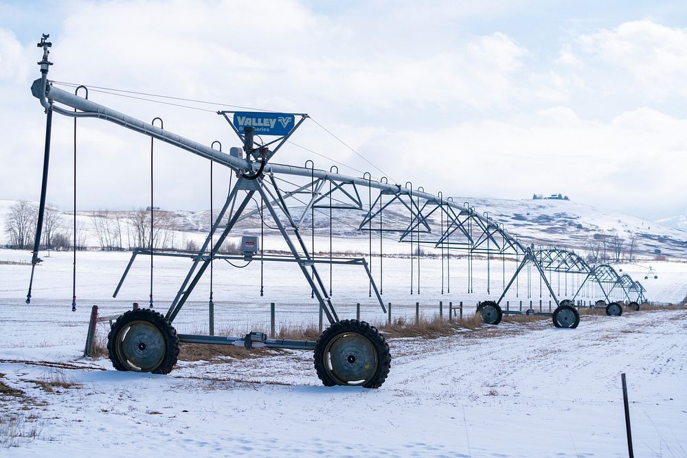 Center pivot irrigates field with water from the Gallatin River watershed. Bozeman, MT. March, 2020. Bozeman, Gallatin…