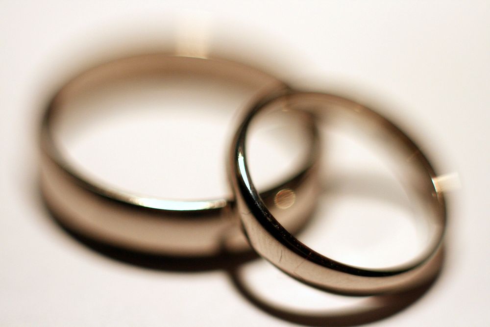 Two wedding rings lie on each other. Original public domain image from Flickr