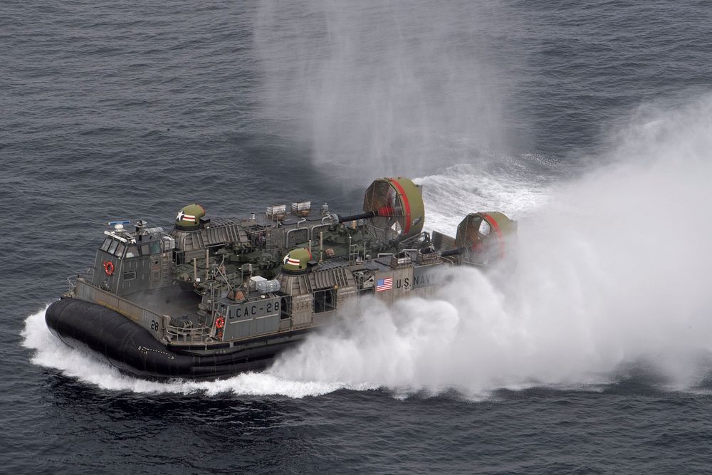 ATLANTIC OCEAN (May 17, 2021) A landing craft, air cushion, attached to Assault Craft Unit (ACU) 4, transits alongside the…
