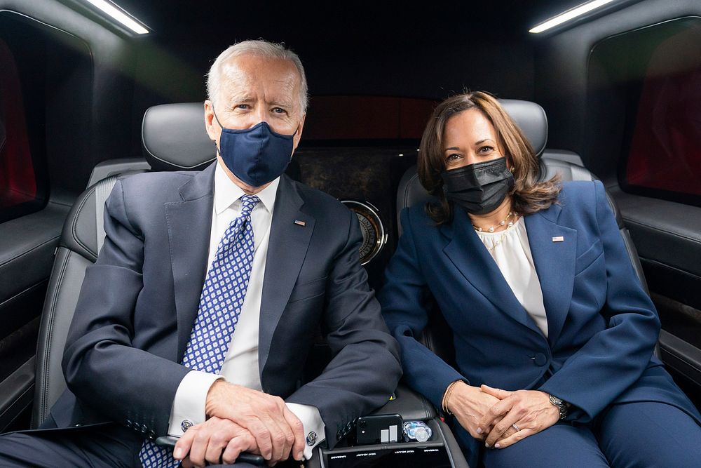 President Joe Biden and Vice President Kamala Harris pose for a photo as they ride in the Presidential limousine from Emory…