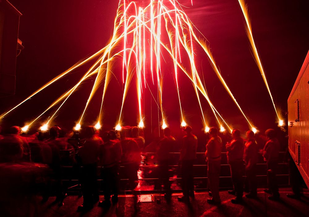 U.S. Sailors ring in the new year aboard the aircraft carrier USS Carl Vinson (CVN 70) with a qualification fire of pencil…