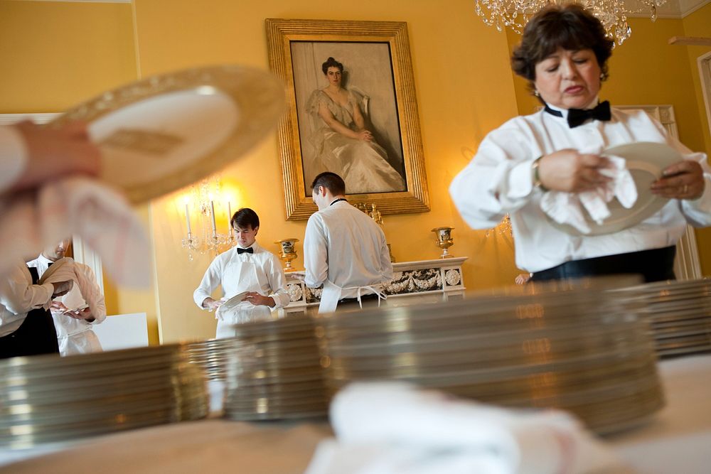 Residence staff prepare for the State Dinner in the Old Family Dining Room of the White House, Jan. 19, 2011.