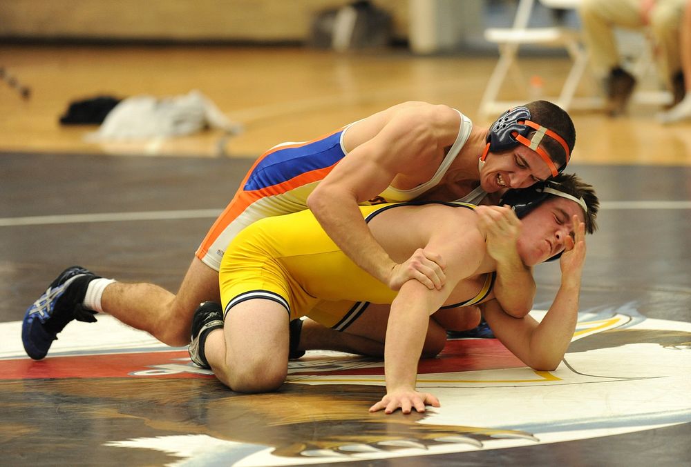 U.S. Coast Guard Academy First Class Cadet Andrew Snyder, a native of Tamaqua, Penn., wrestles against a Trinity College…