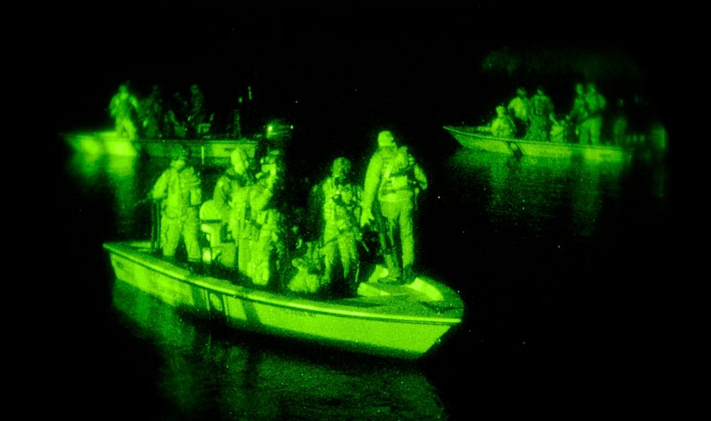 U.S. Soldiers from the 4th Battalion, 10th Special Forces Group patrol in boats during exercise Emerald Warrior in…