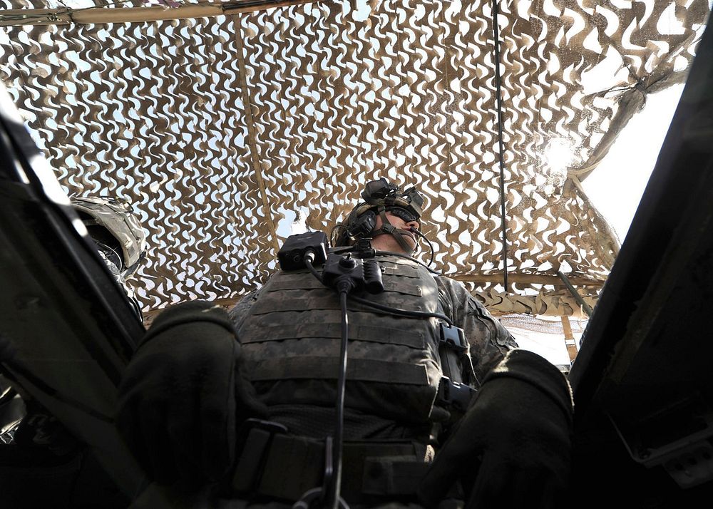 1st Lt. Jordan Bass of U.S. Army Europe's 4th Squadron, 2nd Stryker Cavalry Regiment, scans his surroundings from the turret…