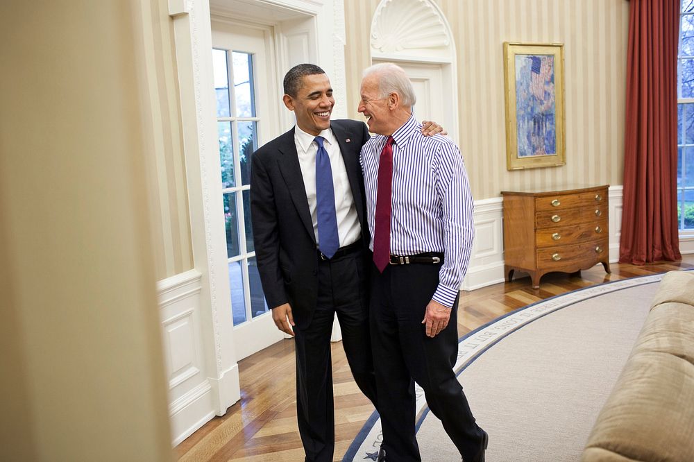 President Barack Obama embraces Vice President Joe Biden in the Oval Office after a meeting on the budget, April 8, 2011.
