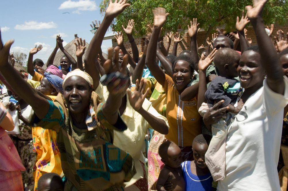 Uganda women hands up in the air and celebrating!. Original public domain image from Flickr