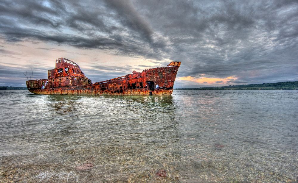 Abandoned rusty ship in Papua New Guinea. Original public domain image from Flickr