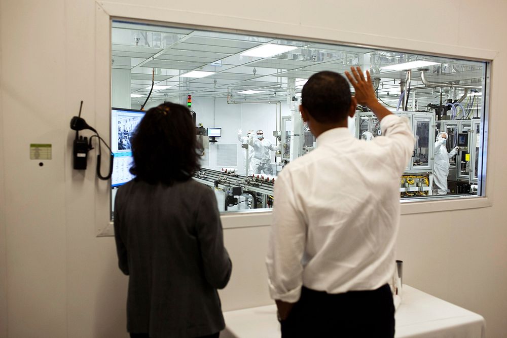 President Barack Obama tours Johnson Controls Inc. with Elizabeth Rolinski, Vice President of Operations, in Holland, Mich.…
