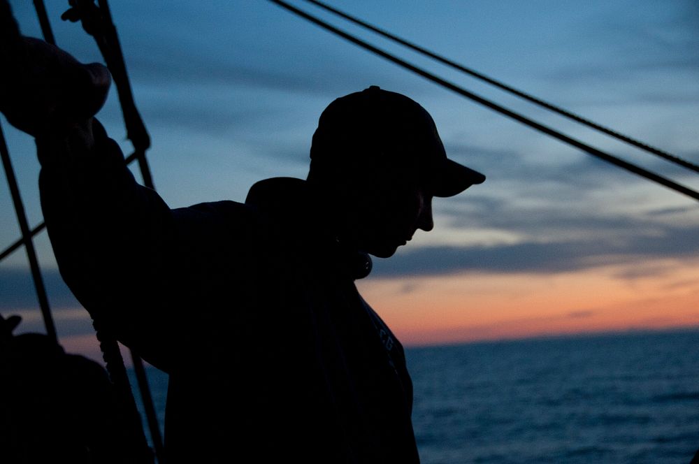 U.S. Coast Guard Petty Officer Jonathan DeHart, 34, a native of Amesbury, Mass., stands watch while underway aboard the U.S.…