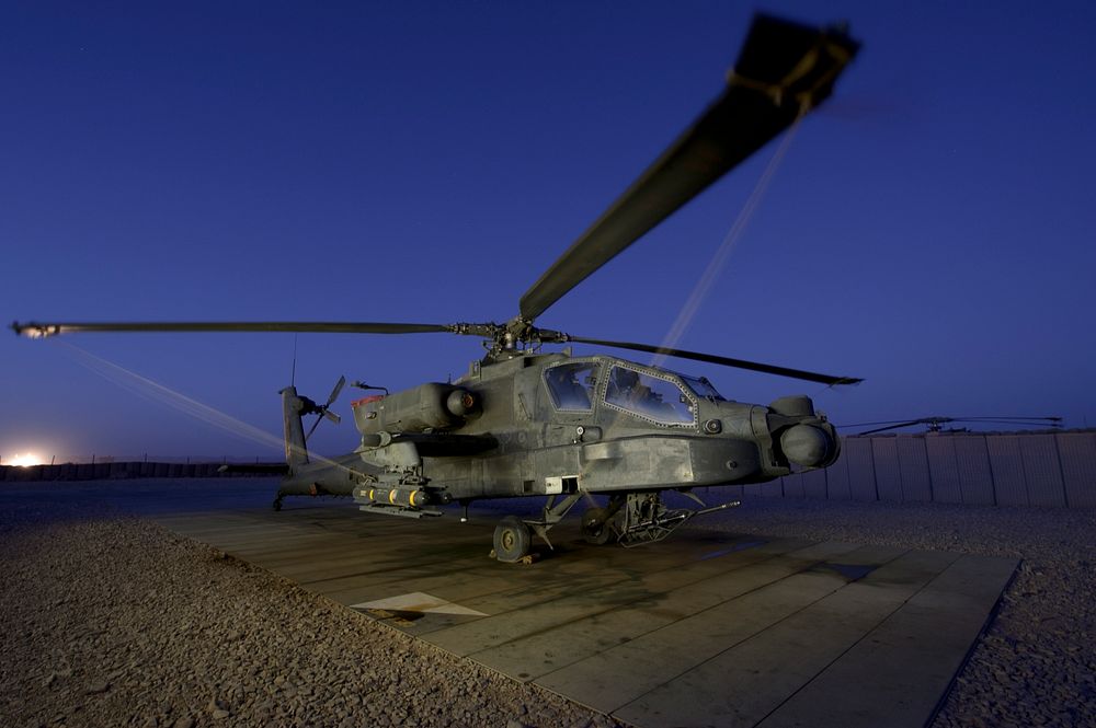 A U.S. Army AH-64D Apache helicopter sits in its parking space at Shindand Air Base in Herat province, Afghanistan, Sept.…