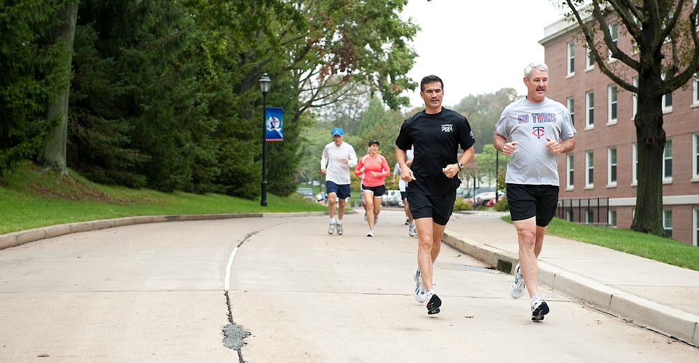 Runners participate in a 2.1-mile fun run at the U.S. Coast Guard Academy in New London, Conn., Saturday, Sept. 23, 2011.…