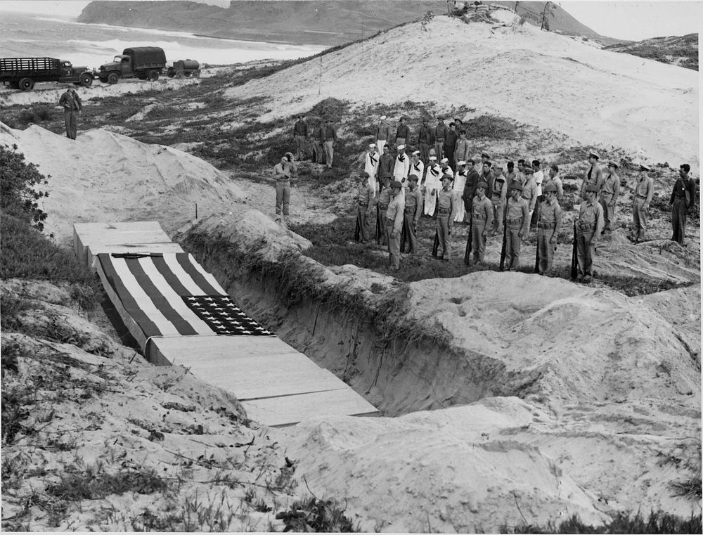 Another scene of services. Burying the dead after Pearl Harbor, casualties of attack on Kaneohe Navail Air Station. Dead.…