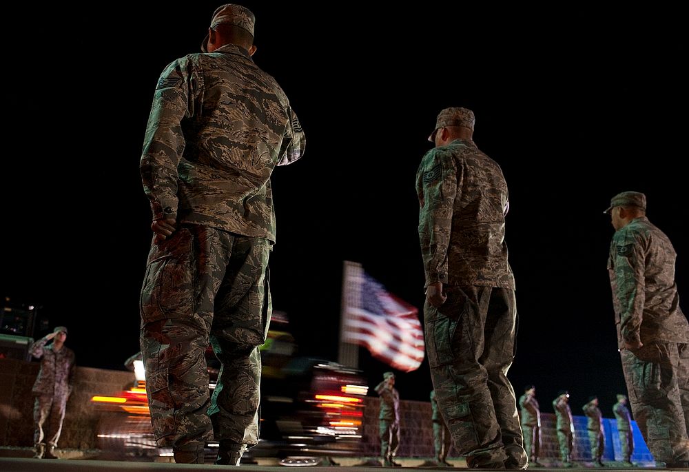 Nellis Airmen salute U.S. Marine Corps Cpl. Jon-Luke Bateman during his dignified arrival Jan. 25, 2012, at Nellis Air Force…