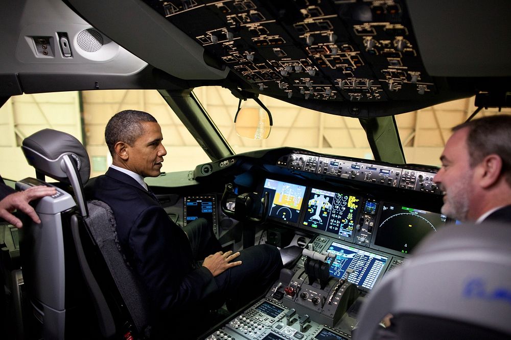 President Barack Obama sits in the cockpit of a 767 during his tour of the Boeing Plant production facility in Everett…