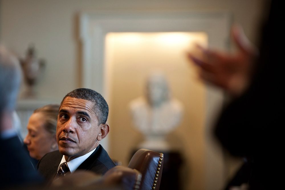 President Barack Obama listens to remarks by Senior Advisor David Plouffe during a Cabinet meeting in the Cabinet Room of…