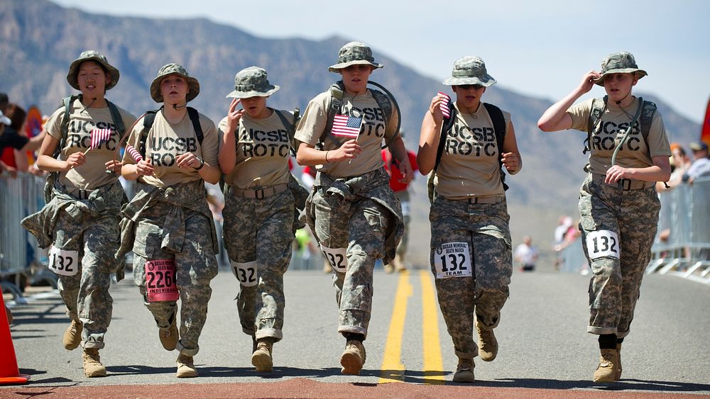 U.S. Army Reserve Officers Training Corps (ROTC) cadets cross the finish line at the Bataan Memorial Death March March 25…