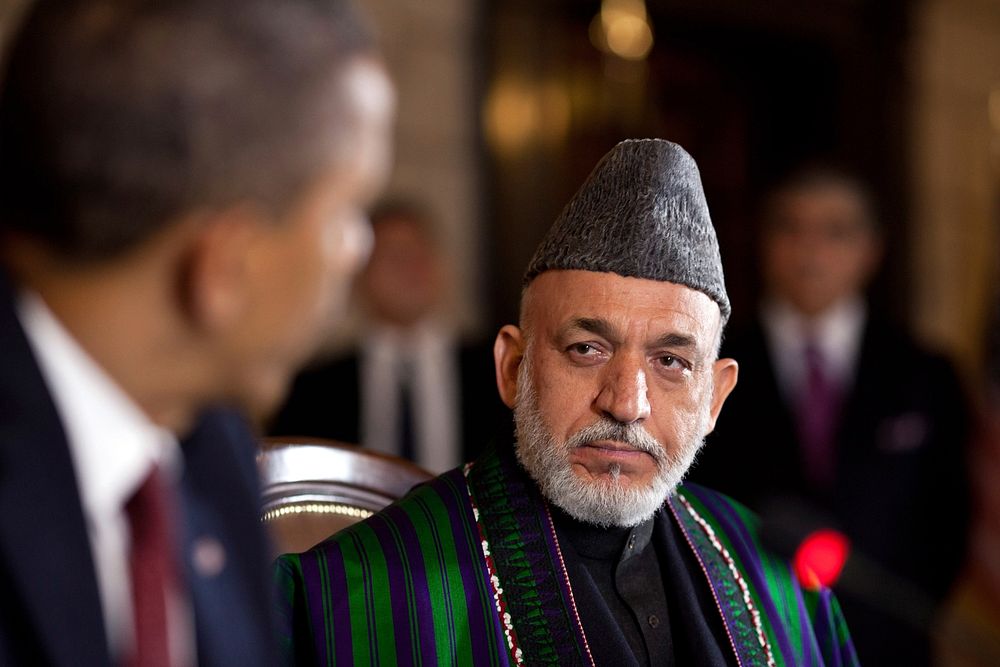 Afghan President Hamid Karzai listens as President Barack Obama delivers remarks during the strategic partnership agreement…