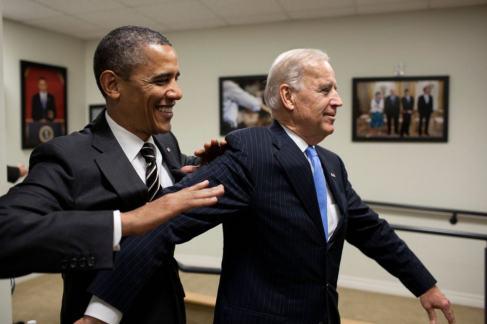 President Barack Obama jokes with Vice President Joe Biden backstage before the STOCK Act signing event in the Eisenhower…
