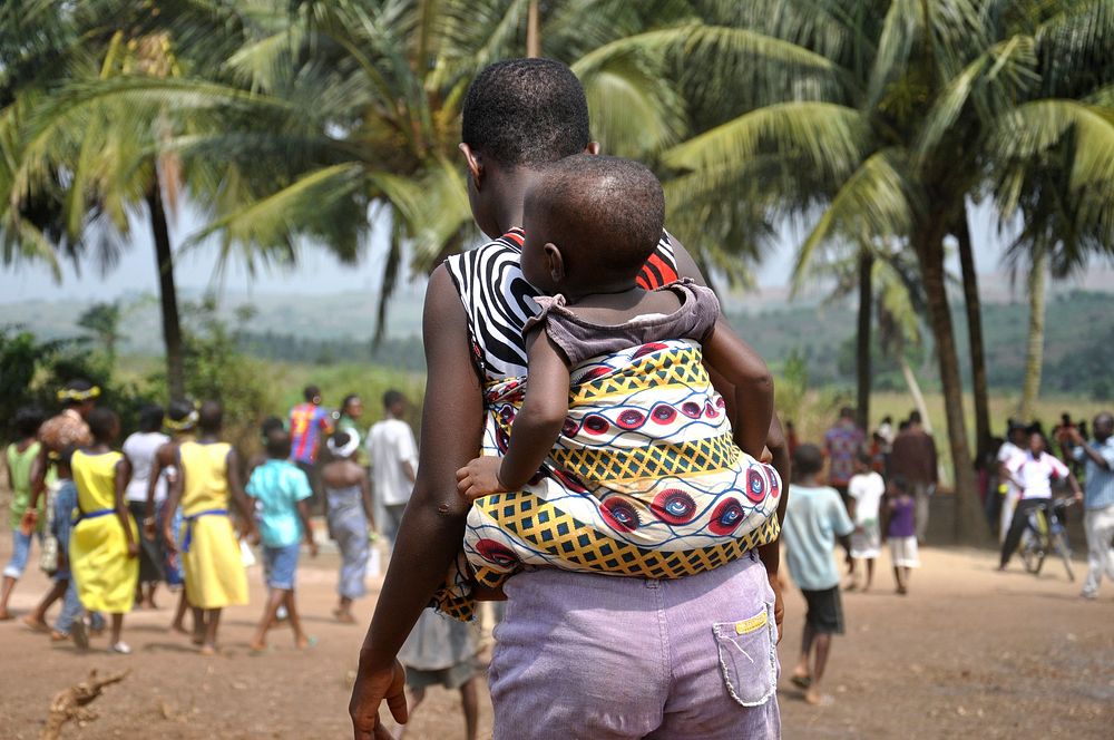 Ghana mother and child visit water pump provided by USAID. (USAID/Kasia McCormick) 2012. Original public domain image from…