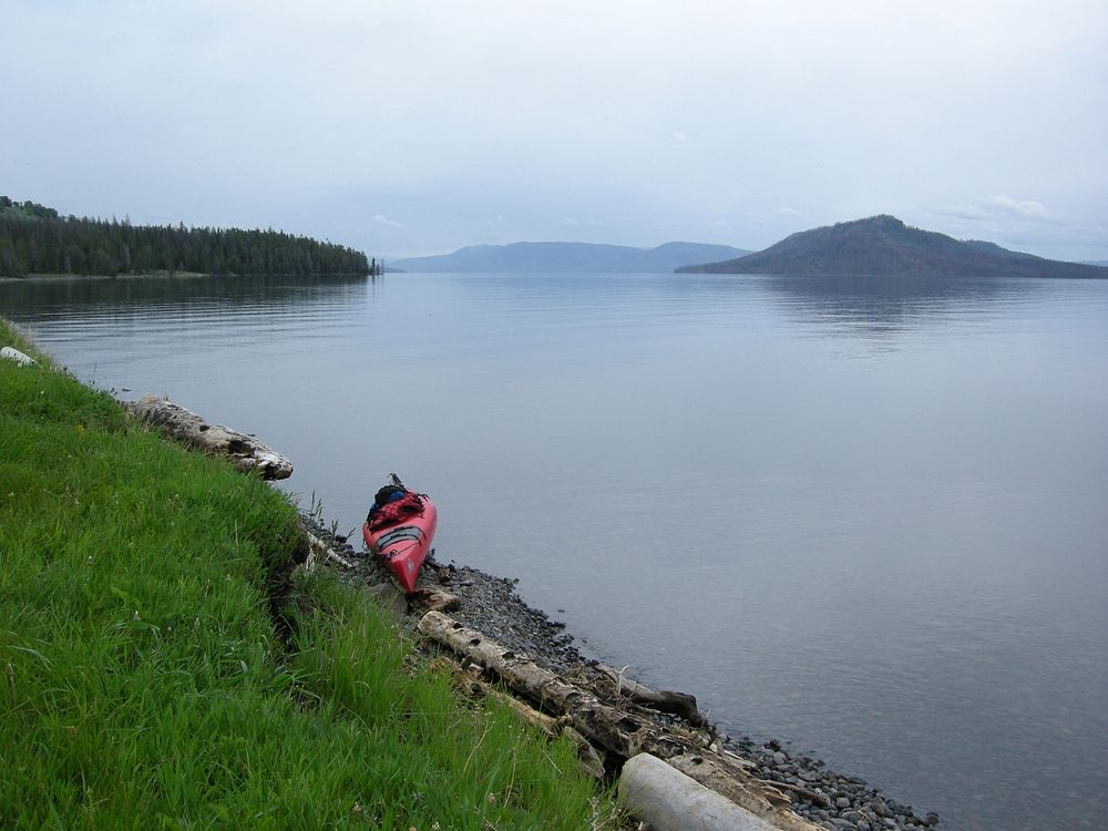 Kayak on Yellowstone LakeBeached kayak at Park Point on Yellowstone Lake looking towards Southeast Arm and Promontory by…