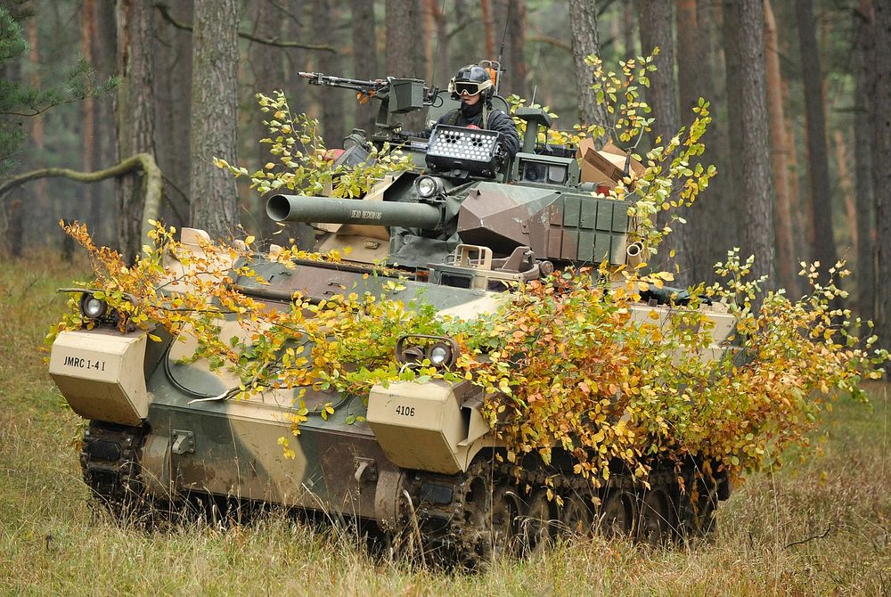 An U.S. Army Europe fighting vehicle, assigned to 1st Battalion, 4th Infantry Regiment, moves into a fighting position…