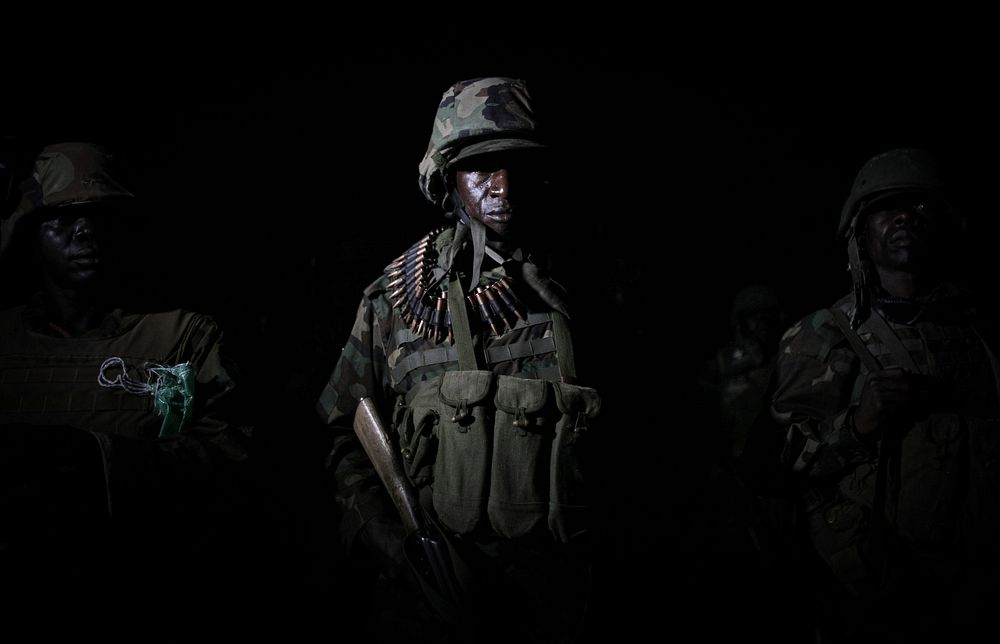 Ugandan troops serving with the African Union Mission in Somalia (AMISOM) form-up in the middle of the night 26 November…