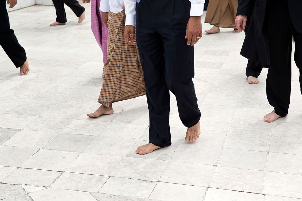 President Barack Obama, guides, and Secret Service agents walk barefoot during a tour of the Shwedagon Pagoda in Rangoon…