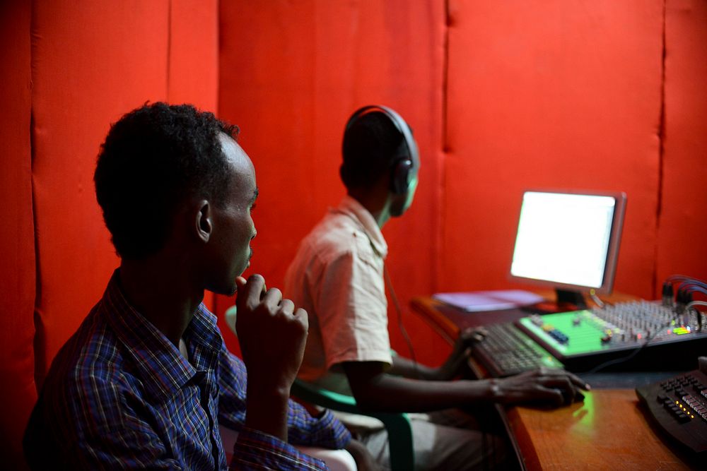An employee at Radio Shabelle prepares the studio for an upcoming show. AU-UN IST PHOTO / TOBIN JONES. Original public…