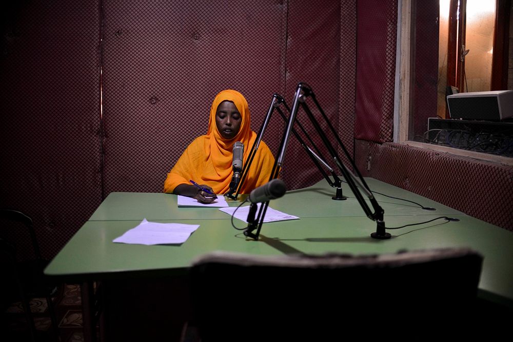 A presenter at Radio Shabelle reads the news. With a population that is still one of the world's poorest, radio continues to…